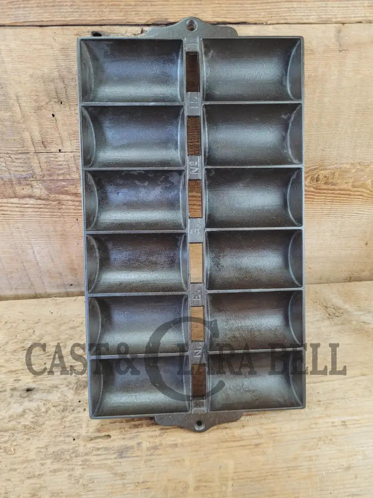 1900βs Griswold New England style (N.E.S embossed) βFrench Rollβ Style cast iron bread pan
