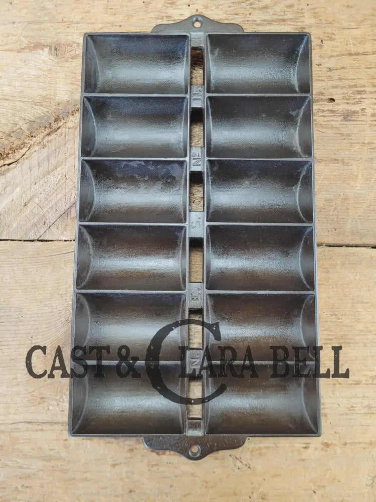 1900βs Griswold New England style (N.E.S embossed) βFrench Rollβ Style cast iron bread pan