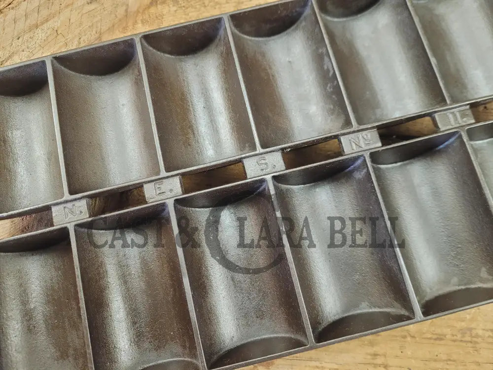 1900βs Griswold New England style (N.E.S embossed) βFrench Rollβ Style cast iron bread pan