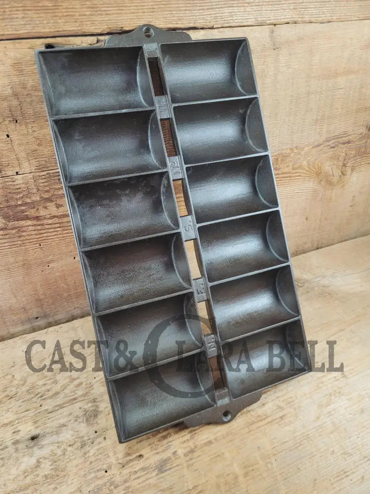 1900βs Griswold New England style (N.E.S embossed) βFrench Rollβ Style cast iron bread pan