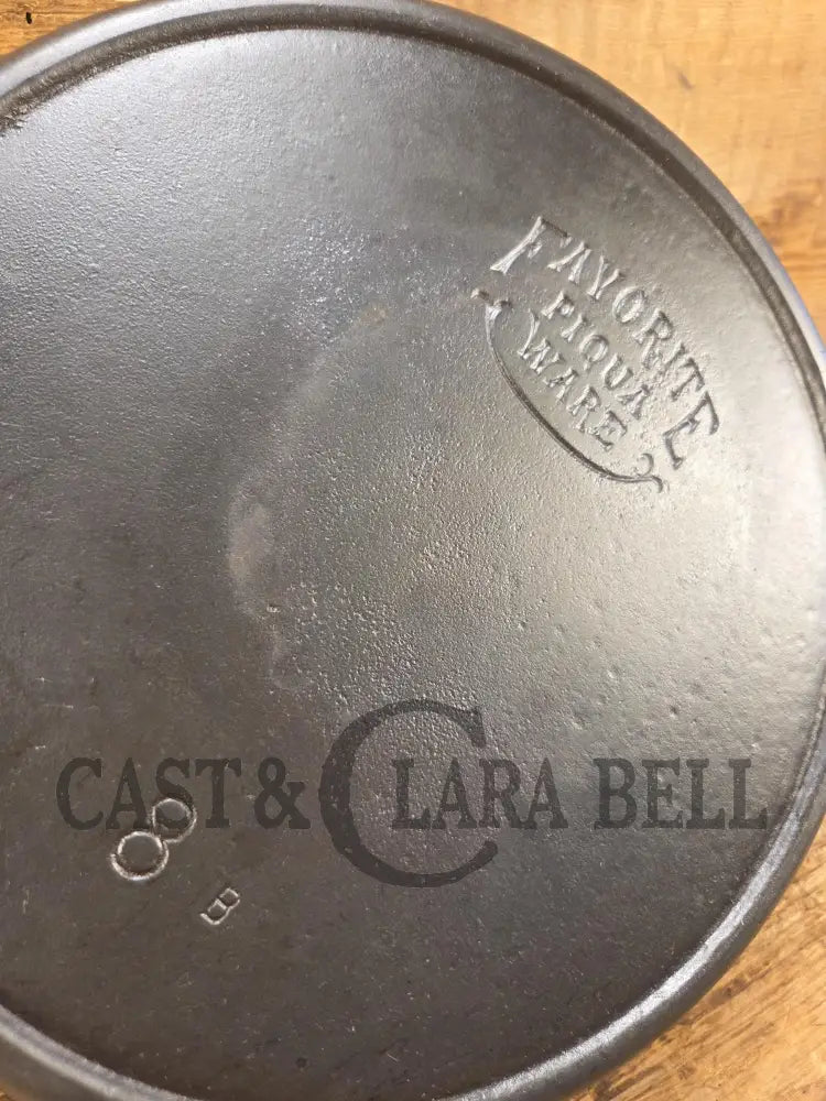 1920βs Favorite Piqua Ware #8 Cast Iron Skillet with Heat Ring and Smiley Logo 8B. SC24 Skillet