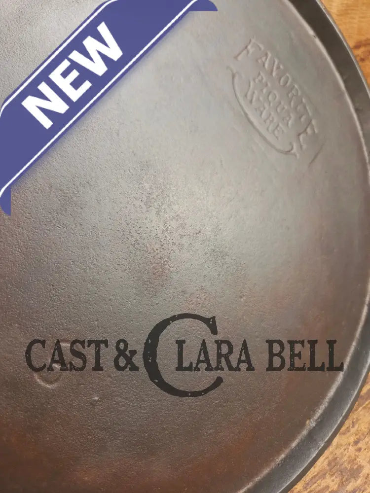 1920’s Favorite Piqua Ware #9 Round Cast Iron Griddle with Smiley Logo and Ghost mark block logo. Griddle