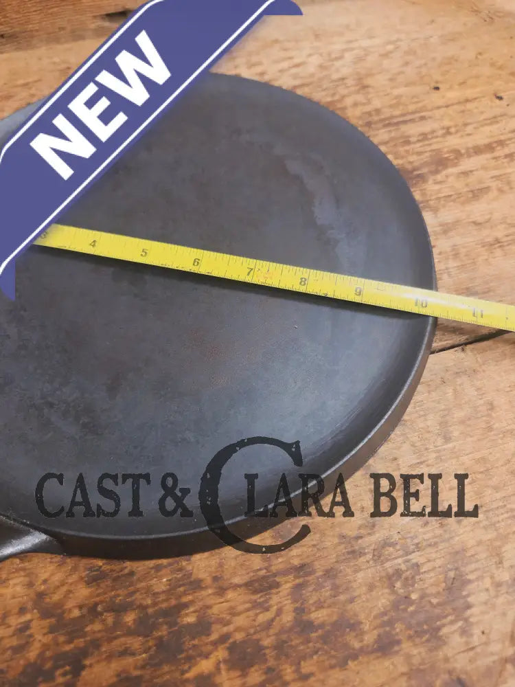 1920’s Favorite Piqua Ware #9 Round Cast Iron Griddle with Smiley Logo and Ghost mark block logo. Griddle