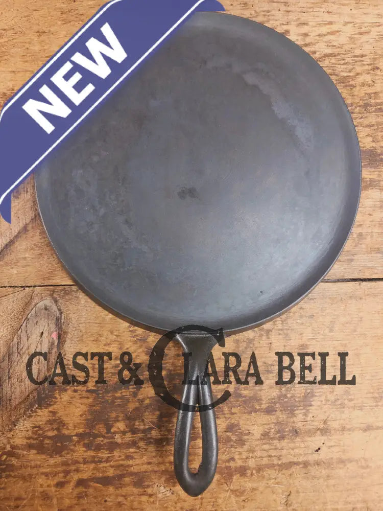 1920’s Favorite Piqua Ware #9 Round Cast Iron Griddle with Smiley Logo and Ghost mark block logo. Griddle