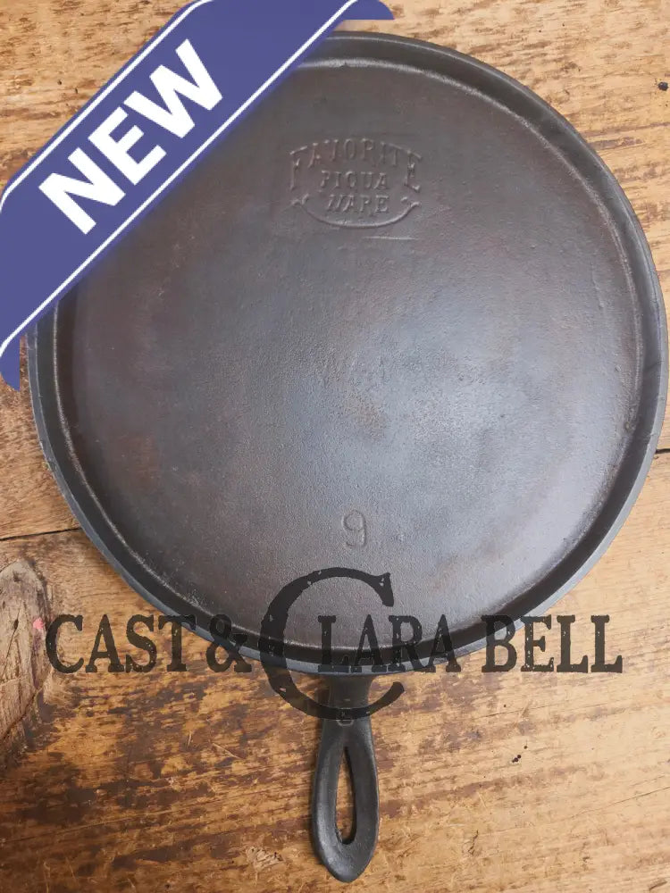 1920’s Favorite Piqua Ware #9 Round Cast Iron Griddle with Smiley Logo and Ghost mark block logo. Griddle