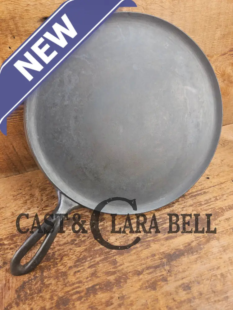 1920’s Favorite Piqua Ware #9 Round Cast Iron Griddle with Smiley Logo and Ghost mark block logo. Griddle