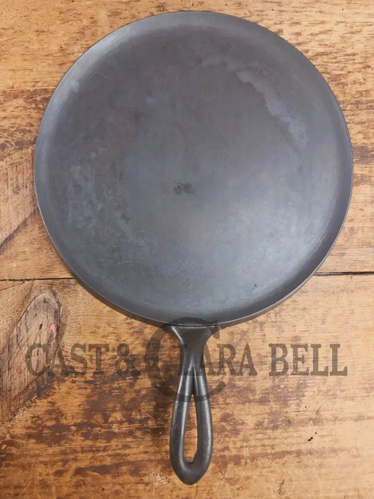 1920’s Favorite Piqua Ware #9 Round Cast Iron Griddle with Smiley Logo and Ghost mark block logo. Griddle