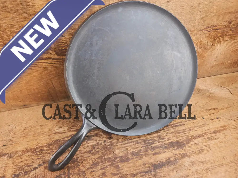 1920’s Favorite Piqua Ware #9 Round Cast Iron Griddle with Smiley Logo and Ghost mark block logo. Griddle
