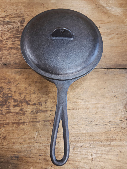 Lovely Lodge #2 quart sauce pan with lid!  Perfect bean pot for your grill!