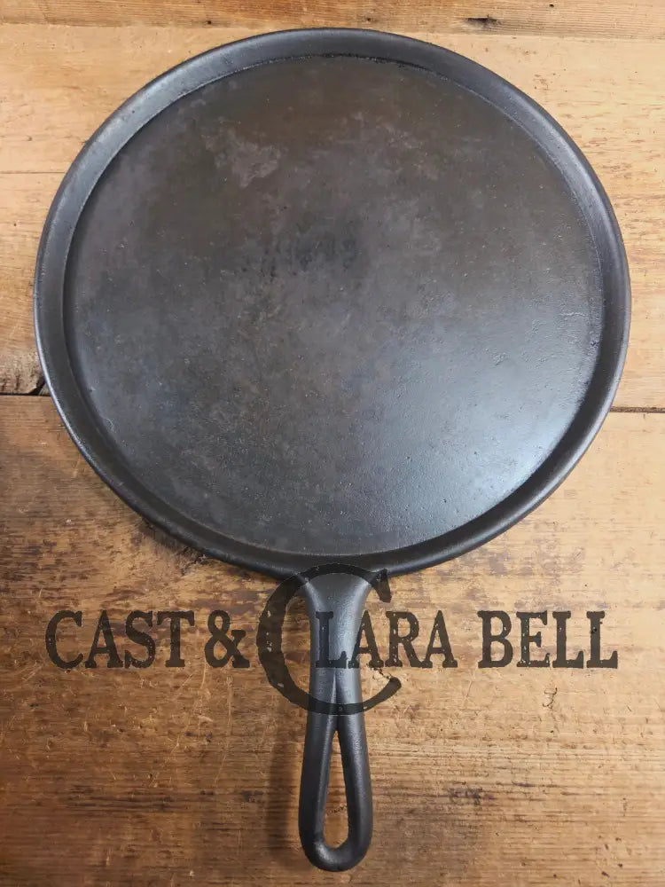 Amazing! Antique #14 handled gate marked round griddle! We’ve never seen one like this. PERFECT pizza peel or griddle