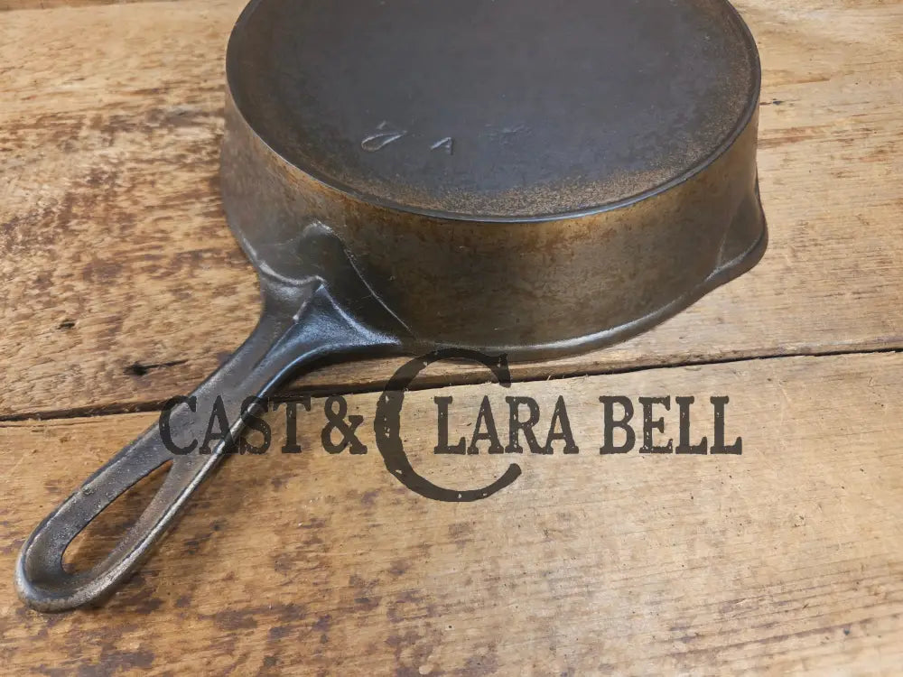 Awesome! 1890βs Griswold ERIE 2nd Series #7 Skillet with Heat Ring and Makerβs Mark Flower and nickel finish! Donβt