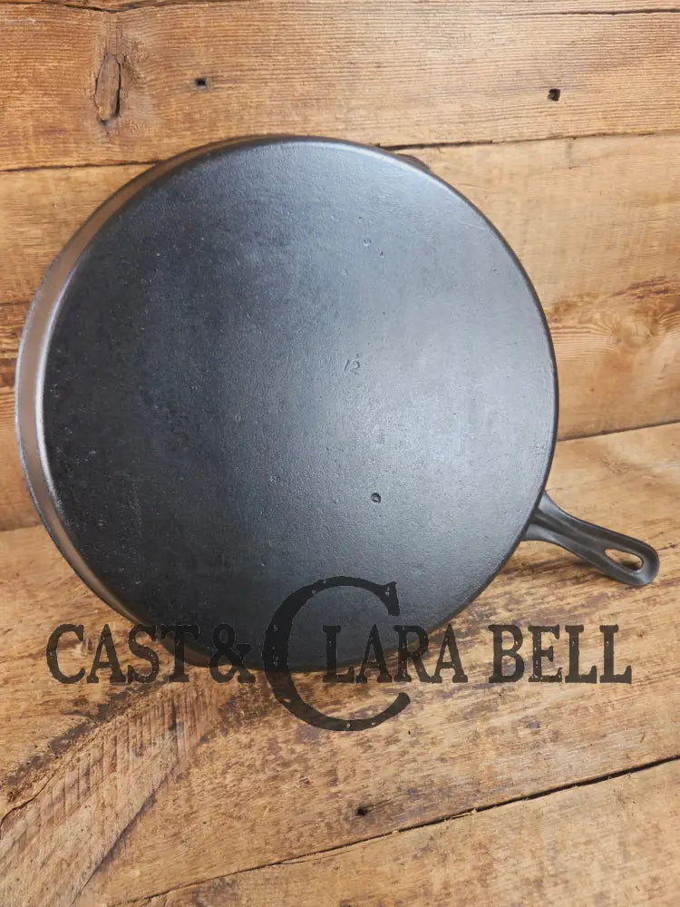 Awesome and tough to find! Scarce smooth bottom #12 Vollrath cast iron skillet. This is a conversation starter! Skillet
