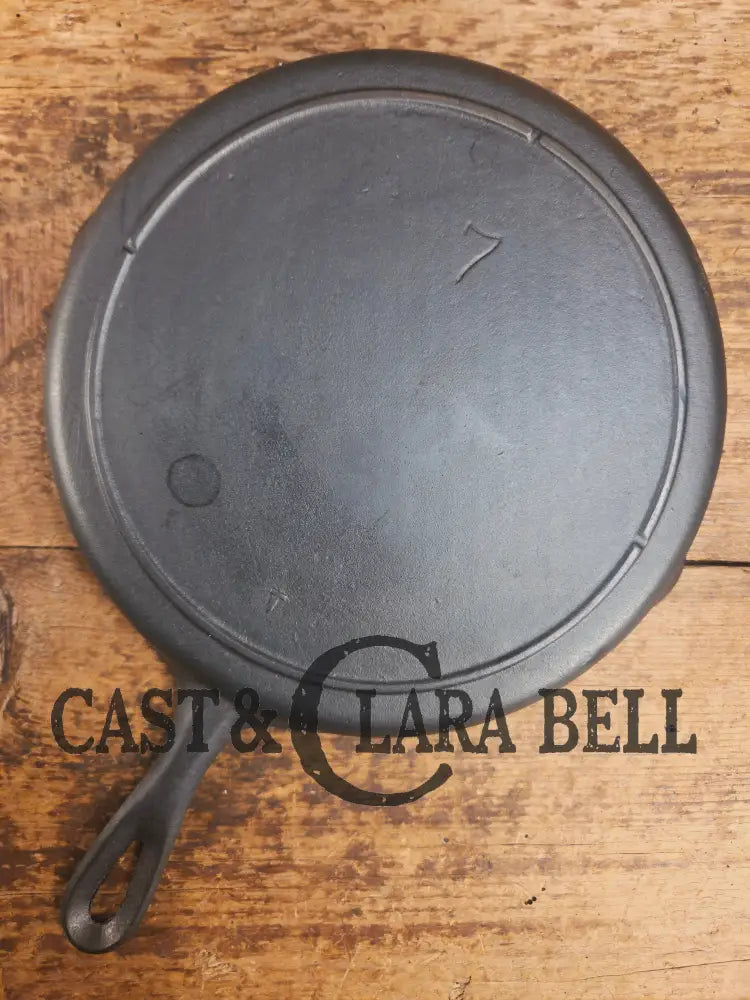 Classic 1910βs Lodge #7 Cast Iron Skillet Three Notch with raised T. Light sleek and ready to cook with! Skillet