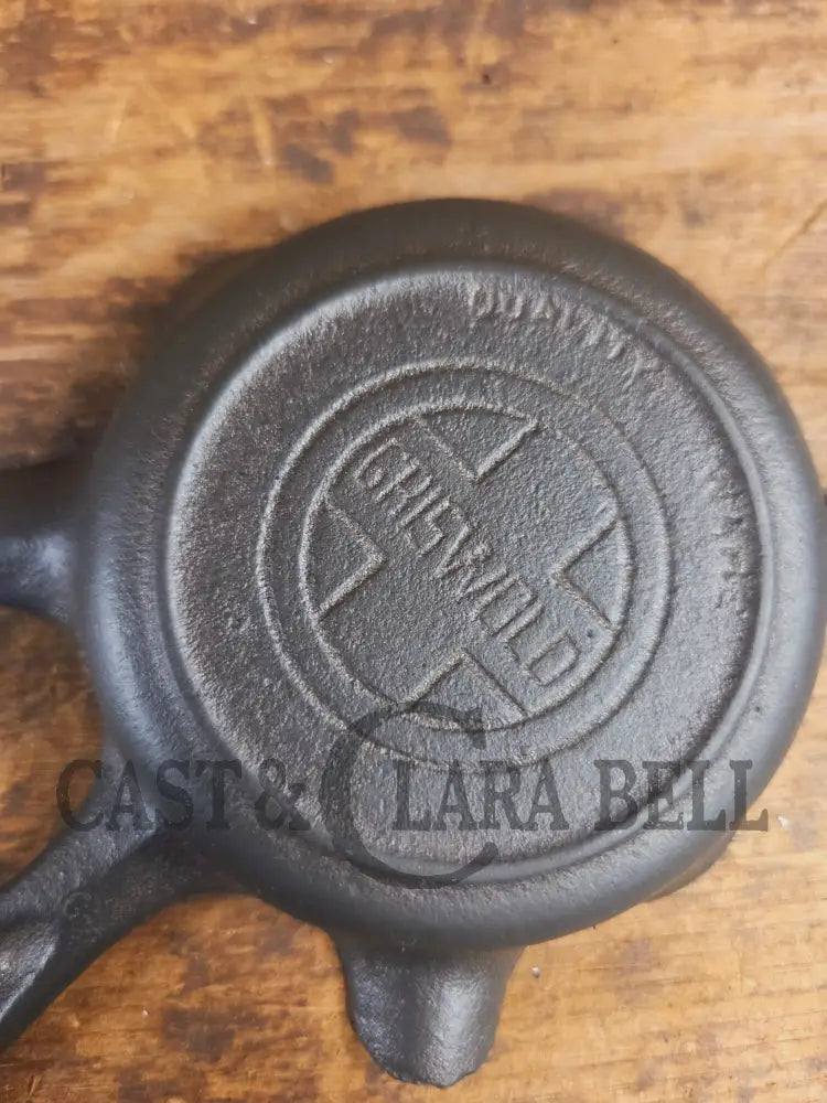 Collectible Griswold ’00’’ Ashtray / Spoon Rest No match holder. Small Novelty cast iron skillet for display or stove!