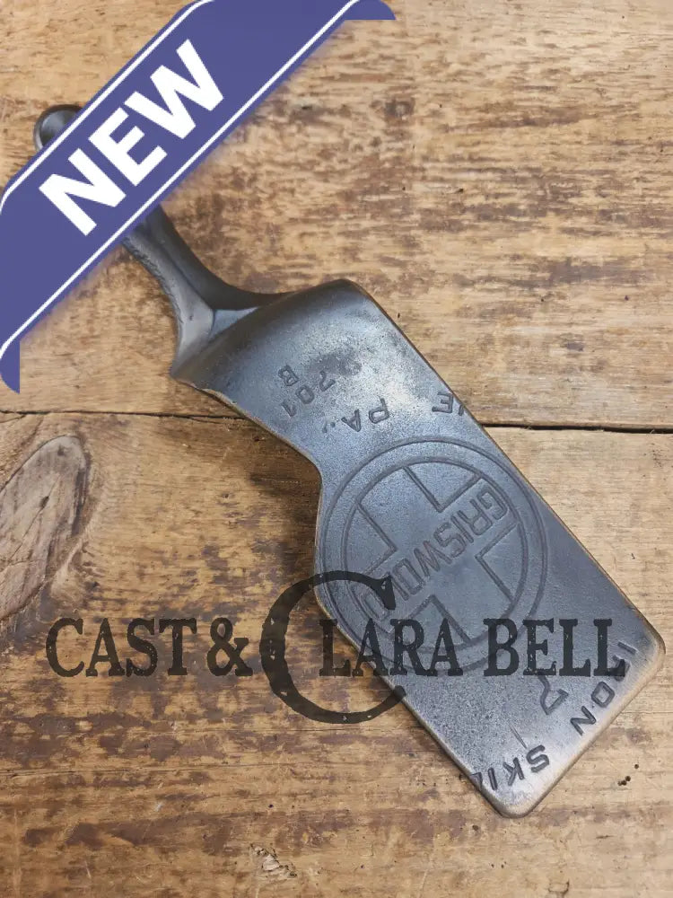 Custom and Funky! Cast Iron Spatula made from a cracked Griswold Large Block 7 Skillet. Funky crack was cut away