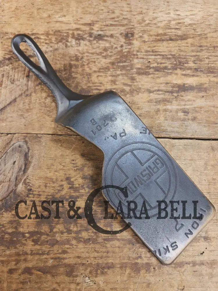 Custom and Funky! Cast Iron Spatula made from a cracked Griswold Large Block 7 Skillet. Funky crack was cut away