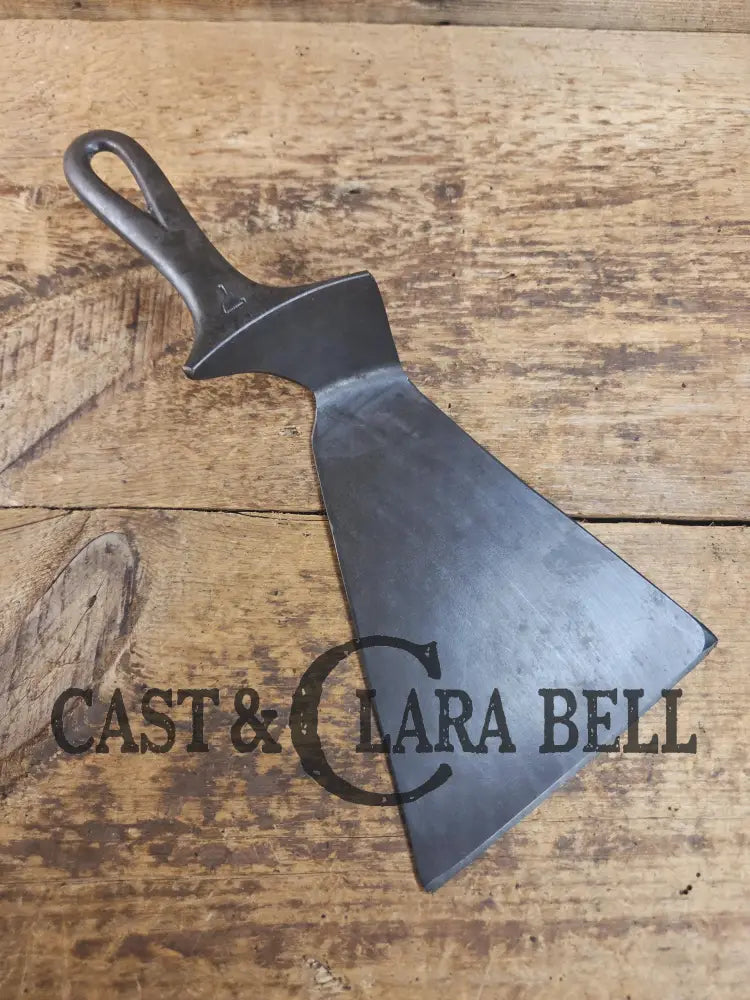 Custom and Funky! Cast Iron Spatula made from a cracked Griswold Large Block 7 Skillet. Funky crack was cut away