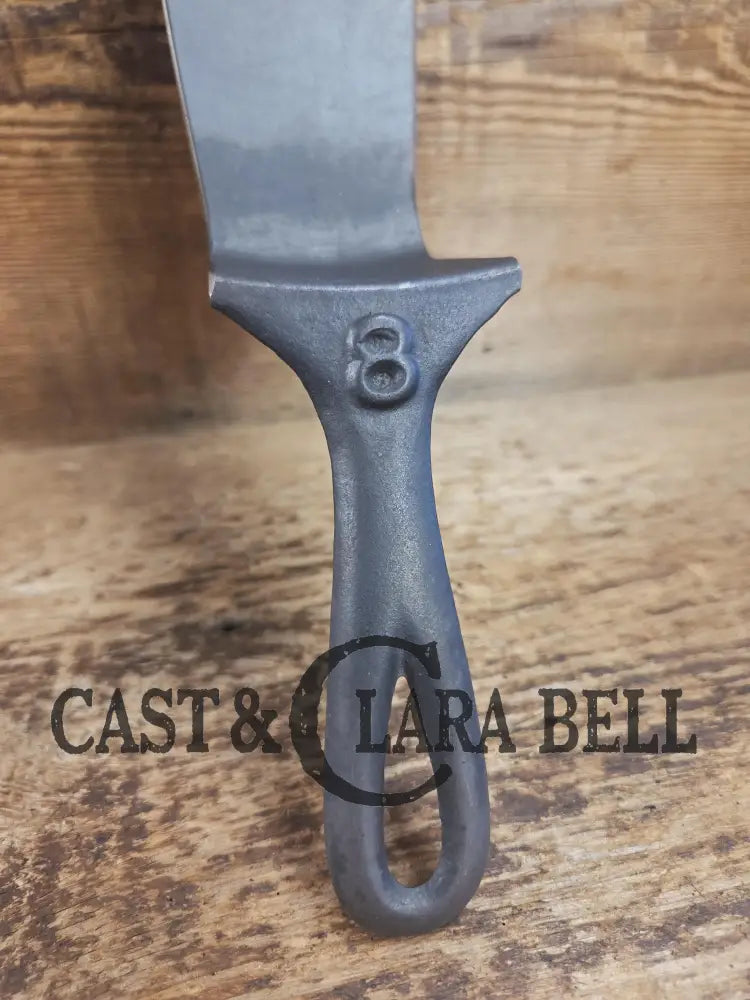 Custom made from a Raised #8 Lodge Arc Logo Cast Iron Skillet Spatula. A collectorsâ prize to own repurposed for a