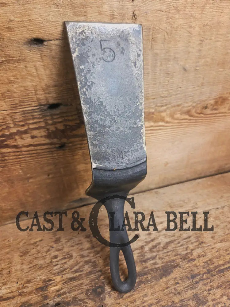 Custom made one of a kind 1940’s Era Lodge repurposed spatula. Turned an ordinary cracked skillet into a grill helper!