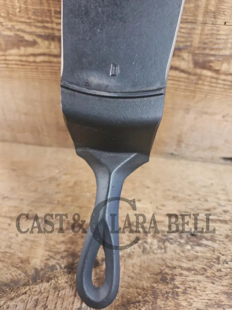 Custom made one of a kind early #9 1900’s Lodge repurposed spatula. Turned an ordinary cracked skillet into a grill