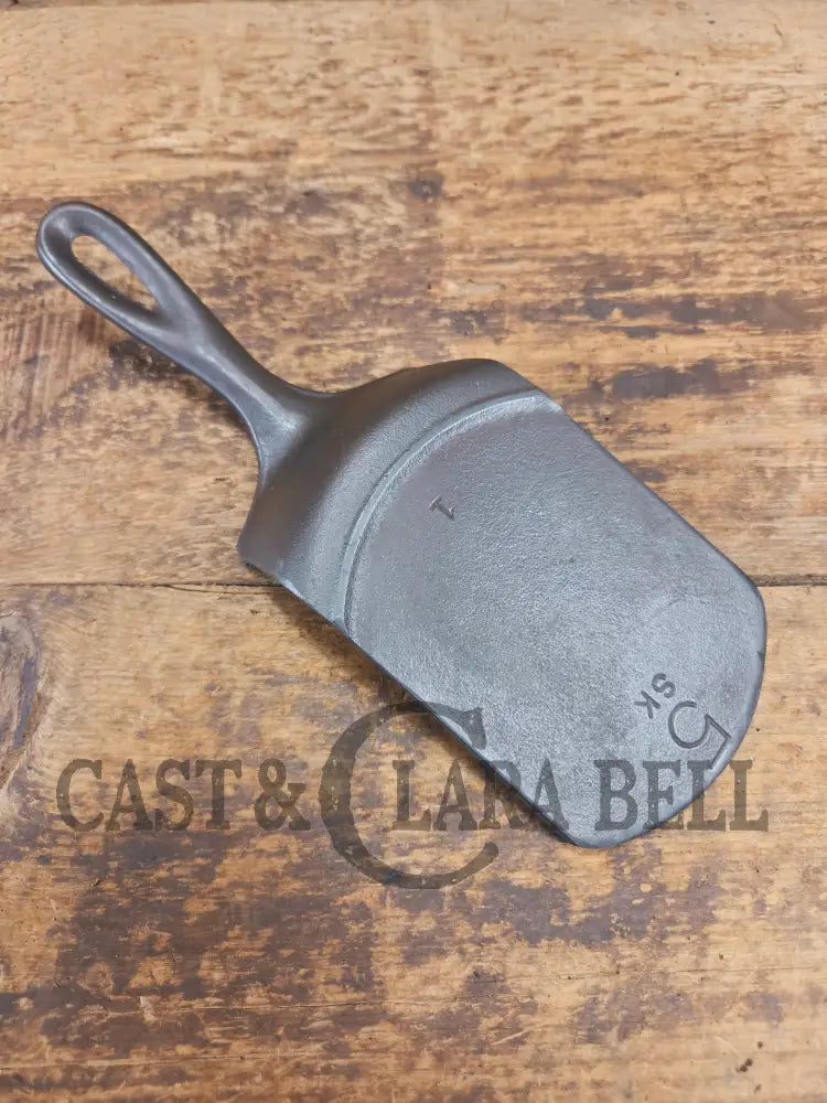 Custom made one of a kind vintage Lodge 5SK 1 repurposed spatula. Turned an ordinary cracked skillet into a grill