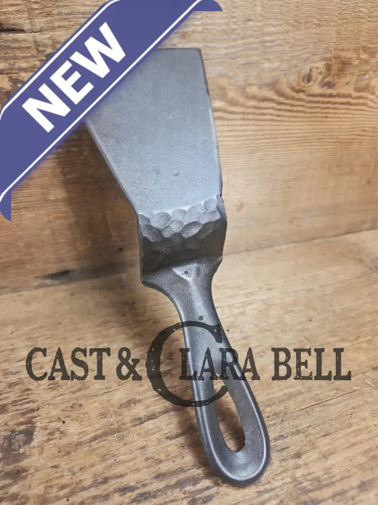 Custom made small Wagner HAMMERED Cast Iron Skillet Spatula. Reclaimed from a #3 Wagner hammered cast iron skillet.