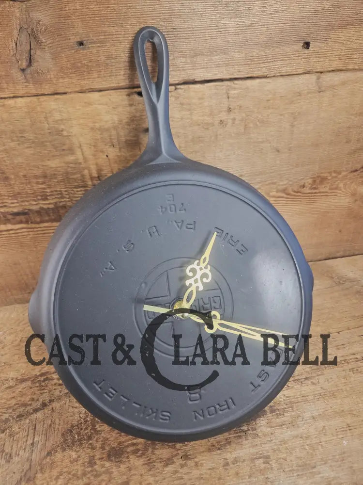 Custom made wall hanging Griswold Clock. Repurposed from cracked skillet. Comes with interchangeable clock mechanics.