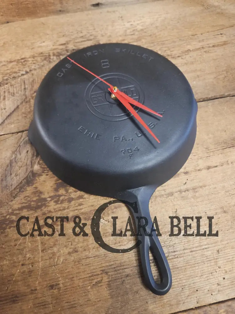 Custom made wall hanging Griswold Clock. Repurposed from cracked skillet. Comes with interchangeable clock mechanics.