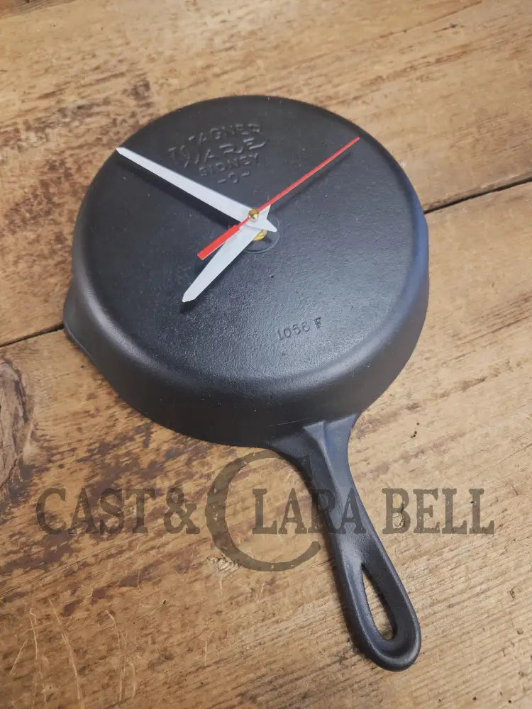 Custom made wall hanging Griswold Clock. Repurposed from cracked skillet. Comes with interchangeable clock mechanics.