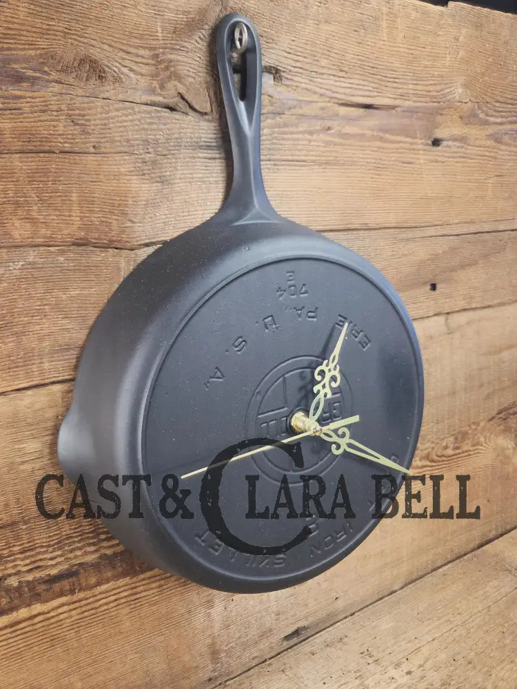 Custom made wall hanging Griswold Clock. Repurposed from cracked skillet. Comes with interchangeable clock mechanics.