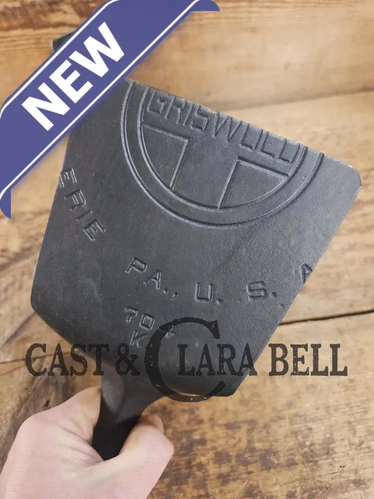 Custom Repurposed Burger Spatula AND grill scraper. Made from a center cracked Griswold 704 skillet. Awesome for the