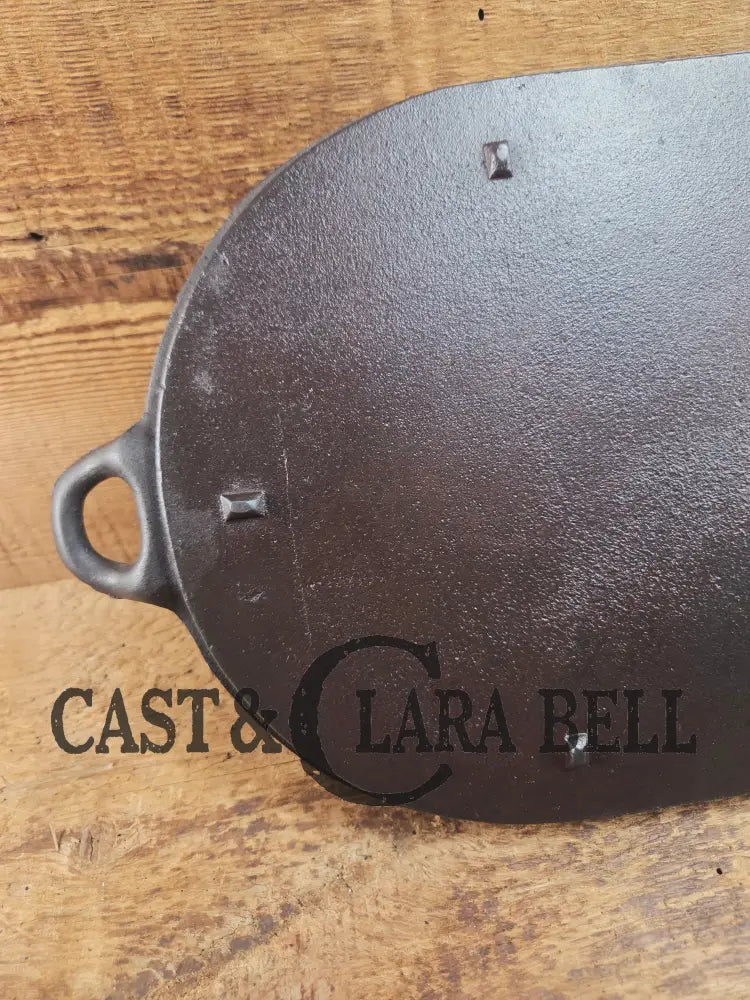 Early 1900’s (Lodge?) #7 cast iron long pan with foot nubs. Perfect for two people or quick meals. VERY cool griddle to