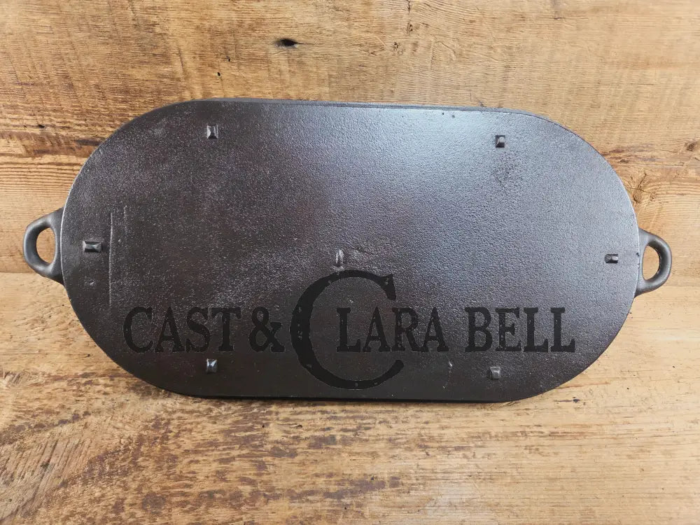 Early 1900’s (Lodge?) #7 cast iron long pan with foot nubs. Perfect for two people or quick meals. VERY cool griddle to