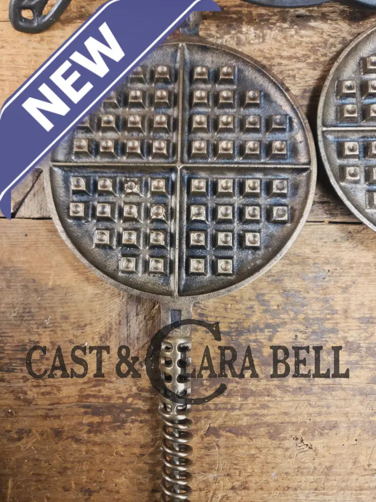 For the eclectic enthusiast!! 1920’s Griswold #8 Waffle Iron 885/886 with Matching Low Base 975. Plated paddles Black