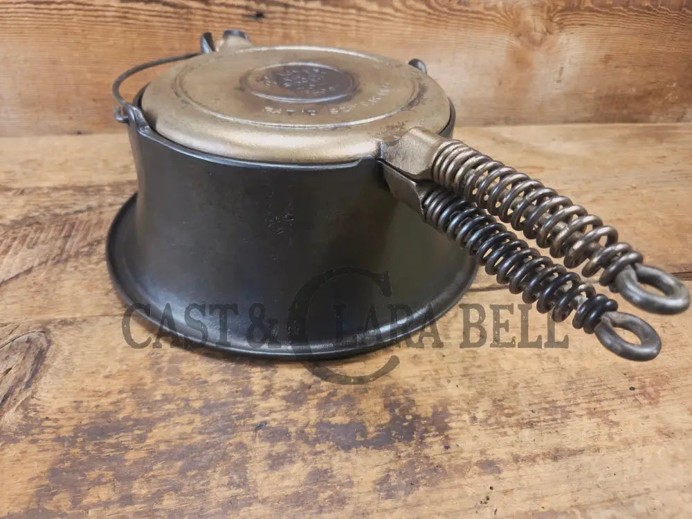 For the eclectic enthusiast!! 1930’s Era Wagner Tall Base Waffle Iron with Nickel Finish Paddles! Really cool patina!