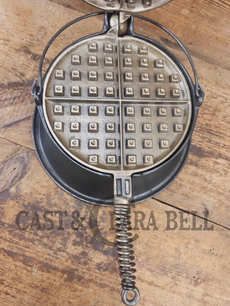 For the eclectic enthusiast!! 1930’s Era Wagner Tall Base Waffle Iron with Nickel Finish Paddles! Really cool patina!