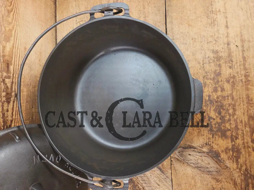 Hard to find 1920โs Griswold #9 Dutch Oven w/ Slant Logo p/n 834 H and p/n 2552 A matching block lid Dutch Ovens