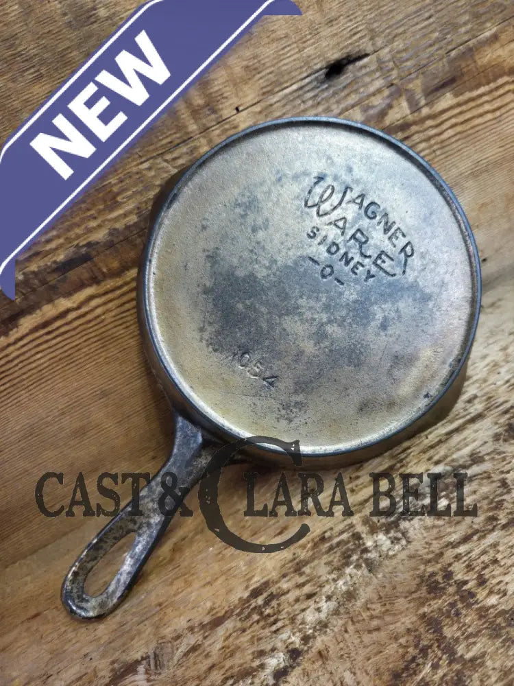 HTF! 1924 Wagner Ware #4 Cast Iron Skillet with Heat Ring 1054. Plating outside black iron inside. Beautiful patina!