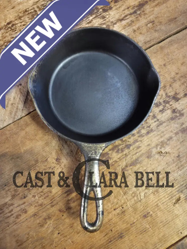 HTF! 1924 Wagner Ware #4 Cast Iron Skillet with Heat Ring 1054. Plating outside black iron inside. Beautiful patina!