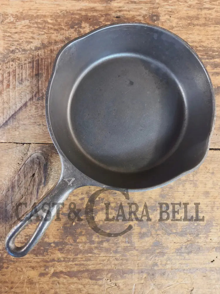 HTF! 1924 Wagner Ware #4 Cast Iron Skillet with Heat Ring 1054. Plating outside black iron inside. Beautiful patina!