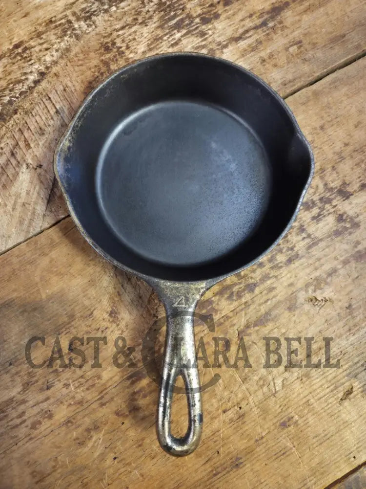 HTF! 1924 Wagner Ware #4 Cast Iron Skillet with Heat Ring 1054. Plating outside black iron inside. Beautiful patina!