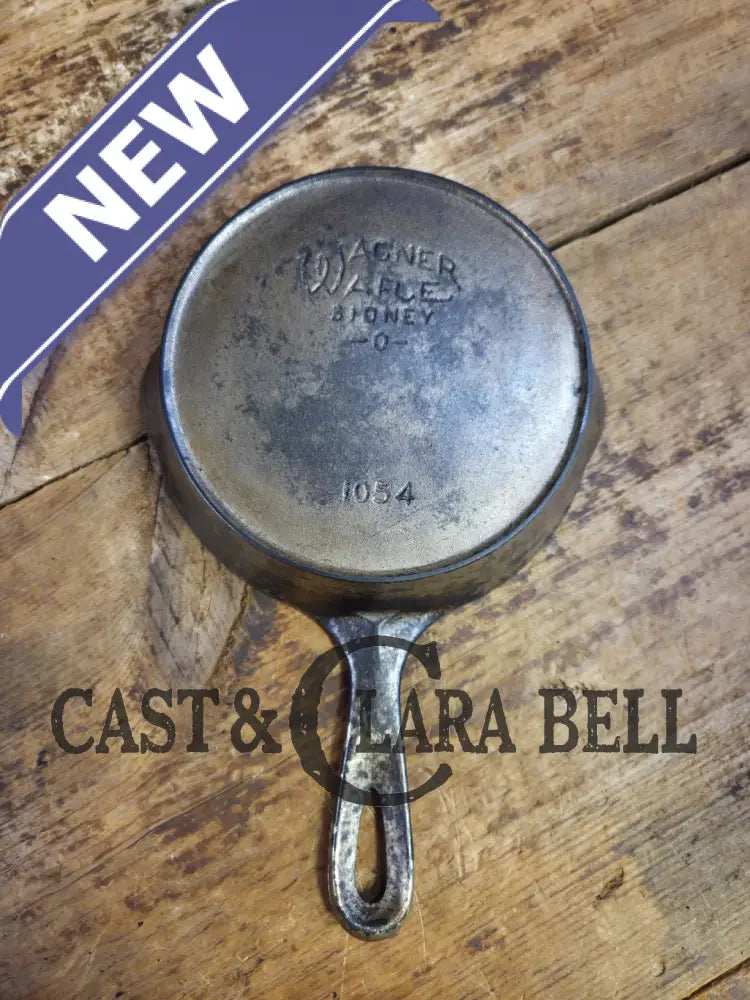 HTF! 1924 Wagner Ware #4 Cast Iron Skillet with Heat Ring 1054. Plating outside black iron inside. Beautiful patina!