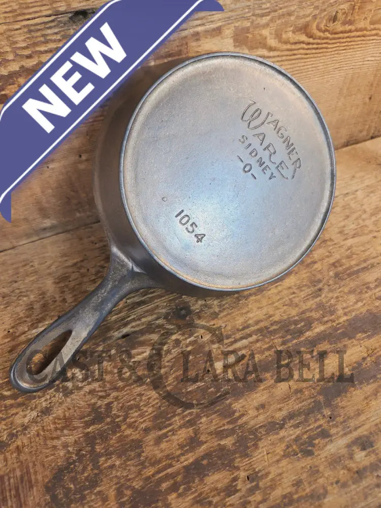 HTF! 1924 Wagner Ware #4 Cast Iron Skillet with Heat Ring 1054. Plating outside black iron inside. Beautiful patina!