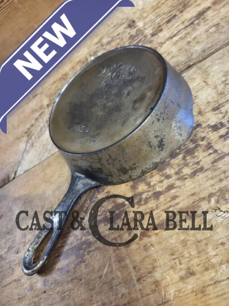 HTF! 1924 Wagner Ware #4 Cast Iron Skillet with Heat Ring 1054. Plating outside black iron inside. Beautiful patina!