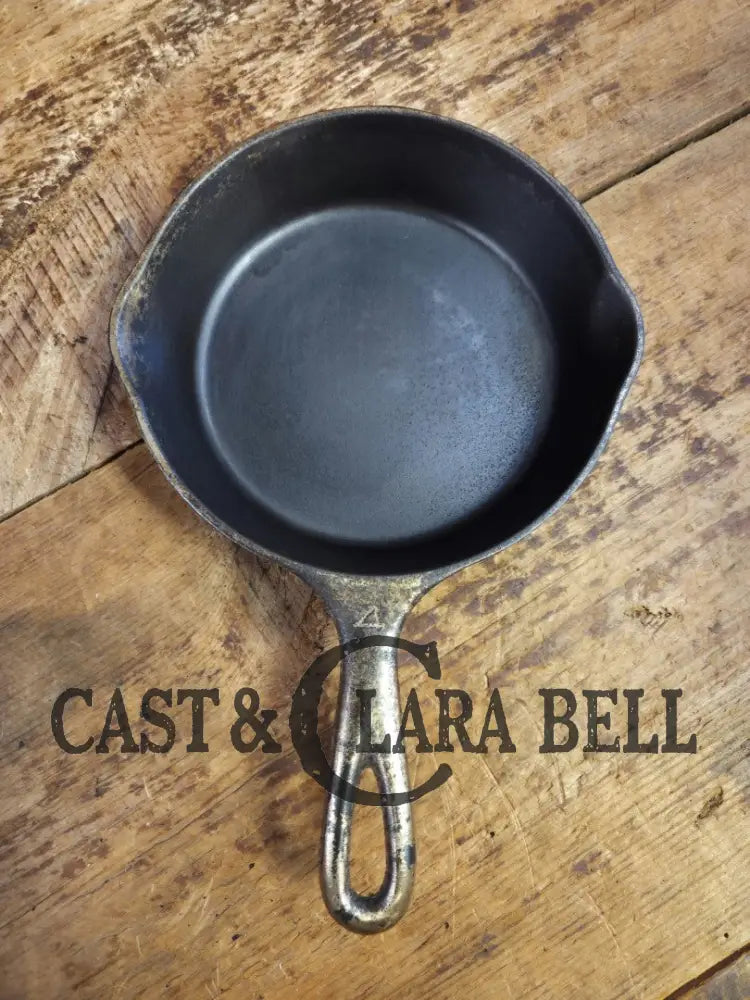 HTF! 1924 Wagner Ware #4 Cast Iron Skillet with Heat Ring 1054. Plating outside black iron inside. Beautiful patina!