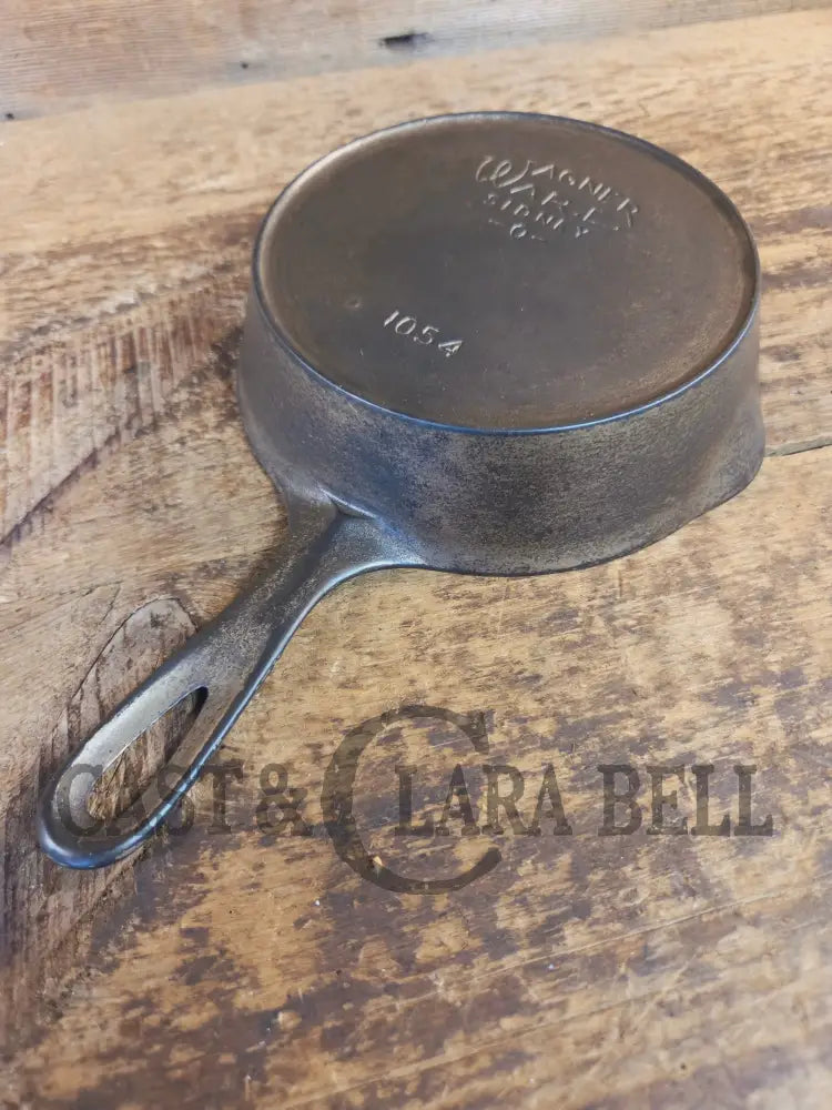 HTF! 1924 Wagner Ware #4 Cast Iron Skillet with Heat Ring 1054. Plating outside black iron inside. Beautiful patina!