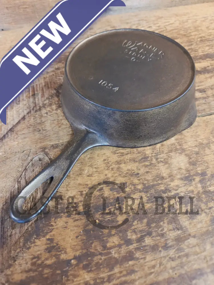HTF! 1924 Wagner Ware #4 Cast Iron Skillet with Heat Ring 1054. Plating outside black iron inside. Beautiful patina!