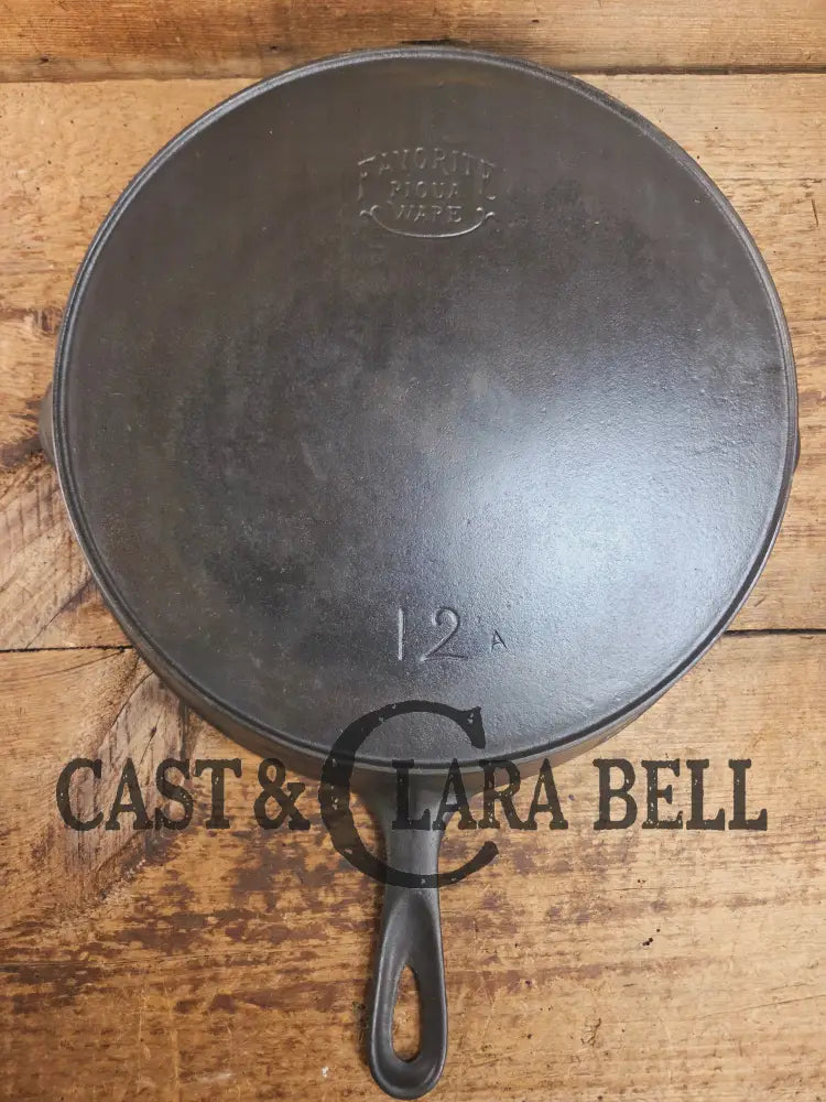 HUGE and hard to find 1910βs Early Favorite Piqua Ware #12 Cast Iron Skillet Smiley Logo great for gas or coil tops!
