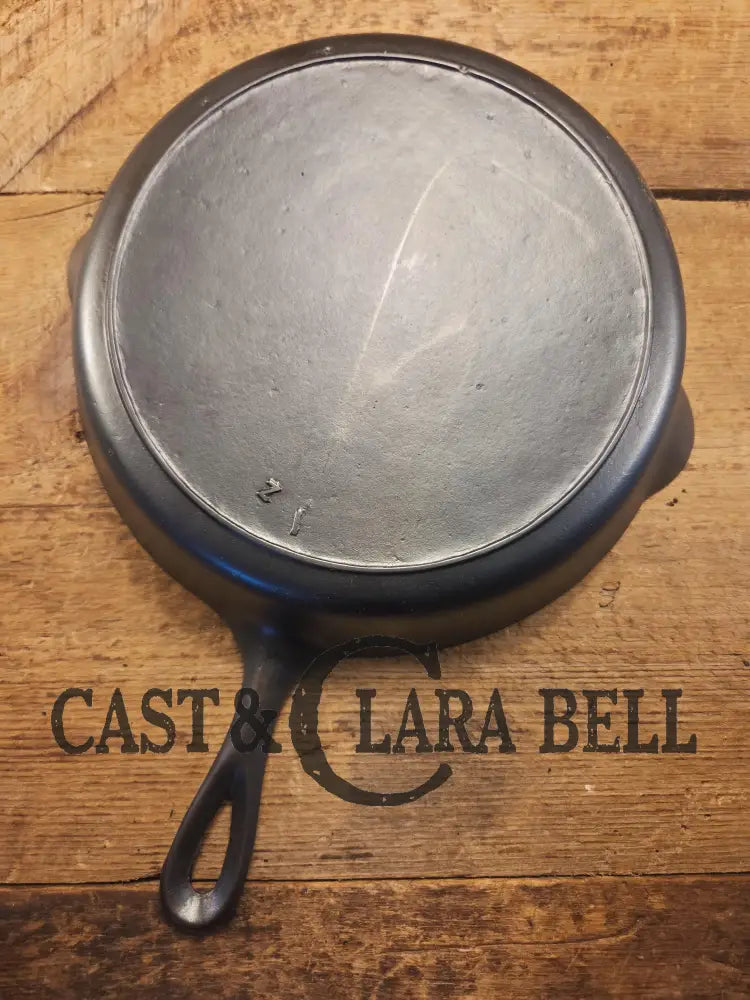 I love this skillet! Classic 1910’s Lodge Raised #7 Heat Ring Single Notch. Light sleek and ready to cook with! Skillet