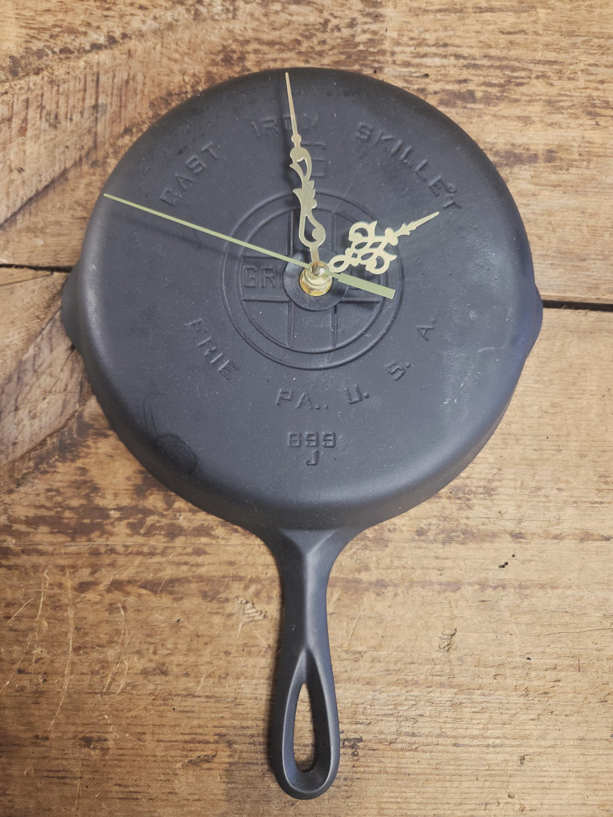 Custom made wall hanging Griswold Clock. Repurposed from cracked skillet. Comes with interchangeable clock mechanics.